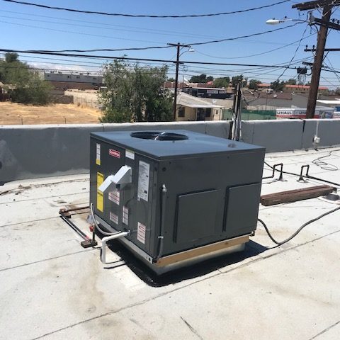 A black color machine with a stand on the roof